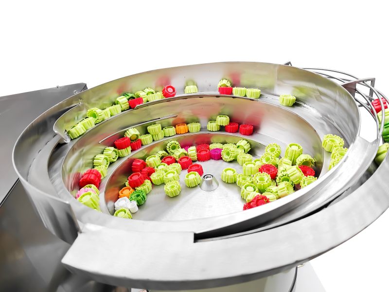 Vibration disc cover arranging machine