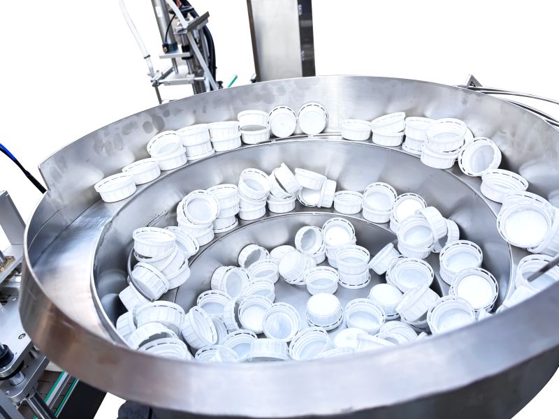 Vibration disc cover arranging machine