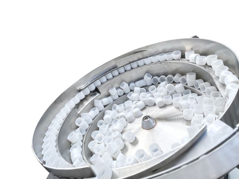 Vibration disc cover arranging machine